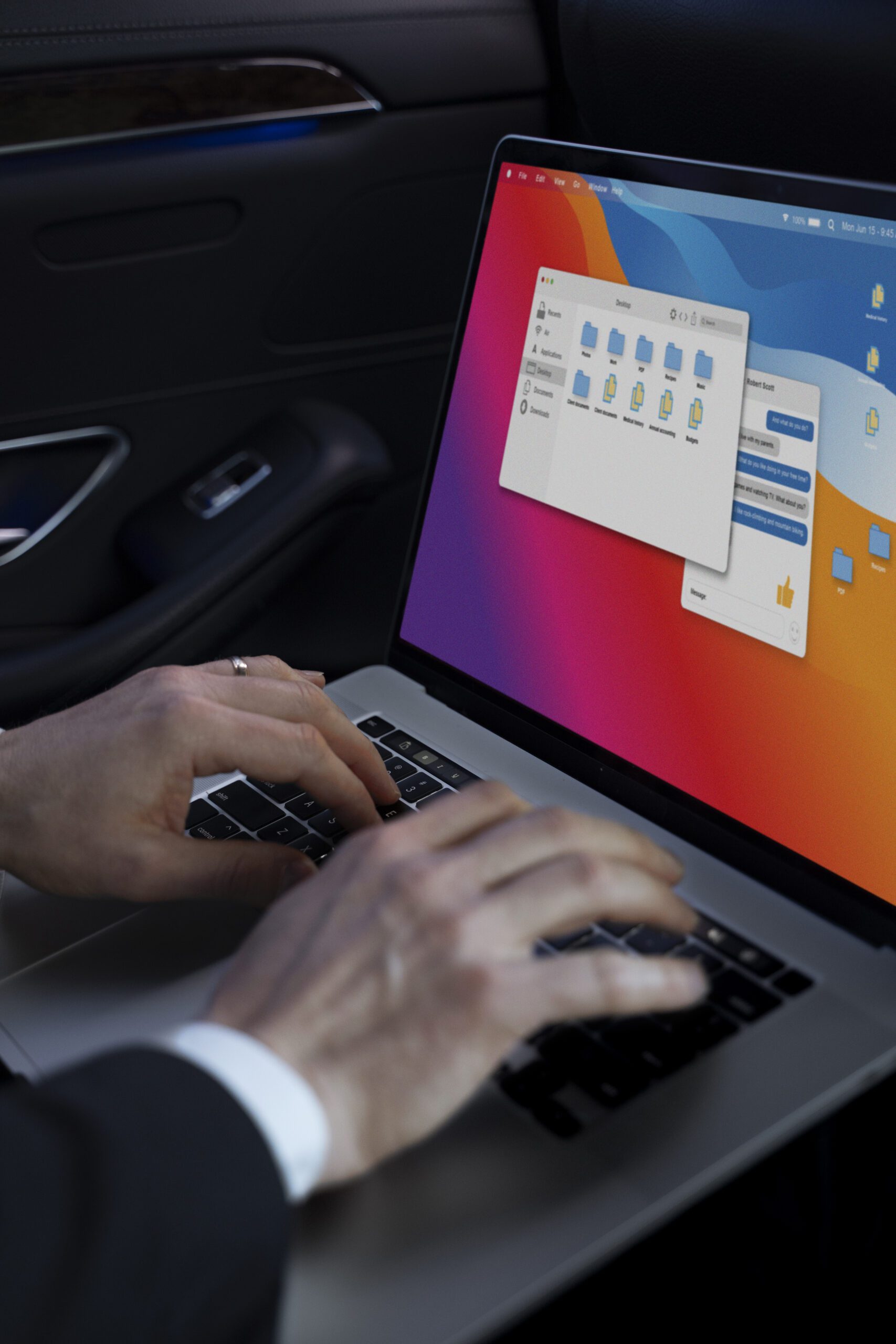 Person managing files on a MacBook with full storage warning displayed